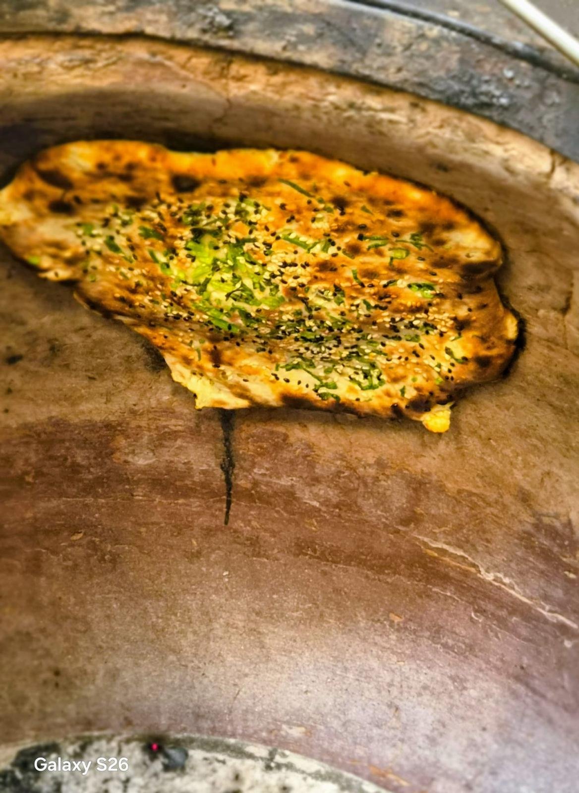Fresh naan in tandoor